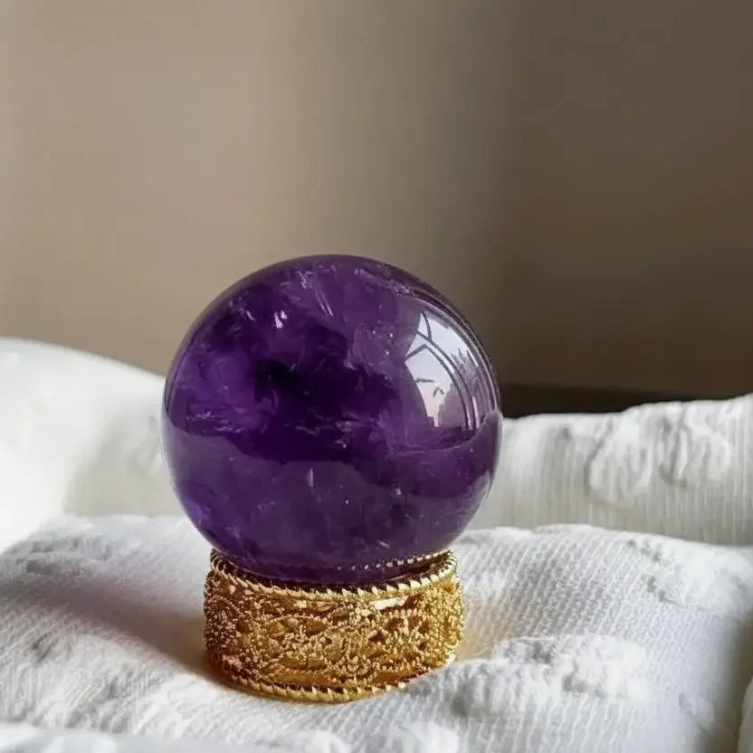 Natural amethyst sphere polished crystal ball close-up