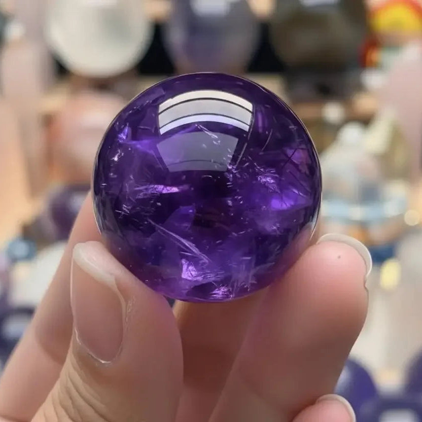 Amethyst sphere detail showing polish and glow